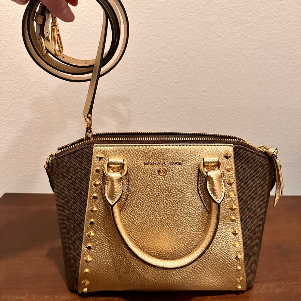 Never used Michael Kors purse. No bag, no box. Gold color.